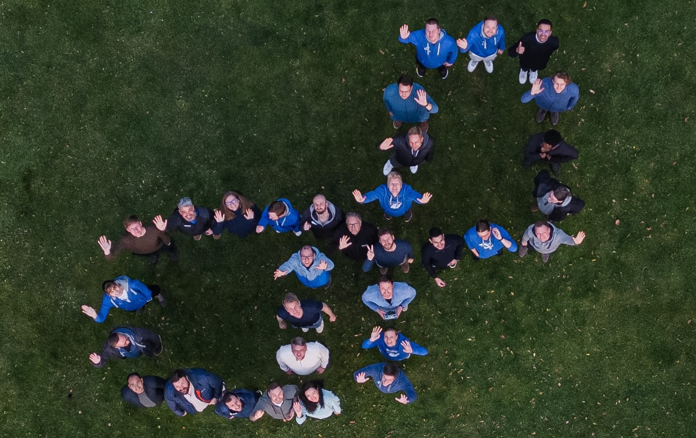 The OpenProject team from above, forming the OpenProject logo